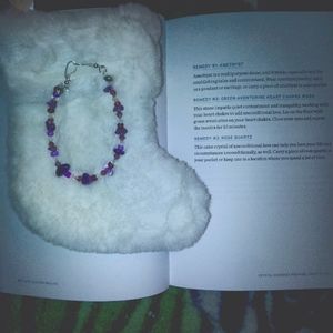 A handmade healing crystal bracelet with easy hooks to latch together.